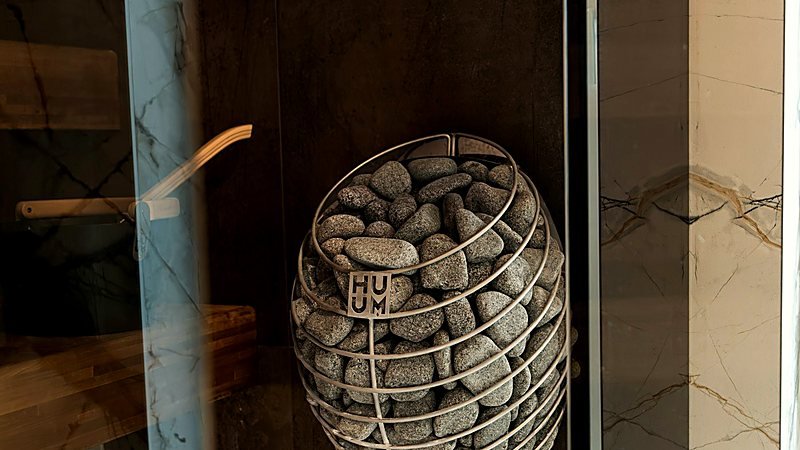 Marble steam room with a heated stone element